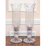 A pair of Baccarat glass candle lanterns of similar form and having etched shades, 34cm high, etched
