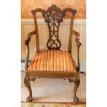 A Chippendale style open elbow armchair,