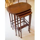 A reproduction nest of three mahogany tables,