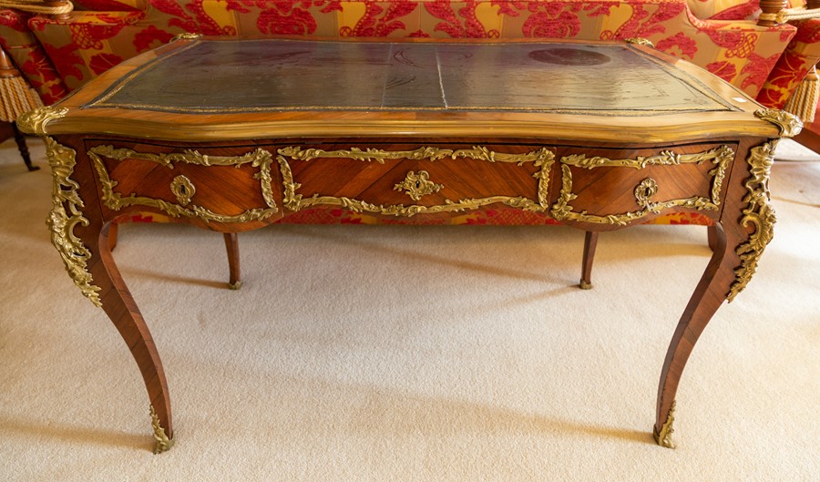 A French kingwood and gilt metal mounted Louis XV style bureau plat by Maison Krieger, Paris,