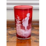 A small Mary Gregory type cranberry glass beaker, 10.5cm high.