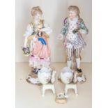 A pair of German porcelain figures of a rustic maid and gallant,