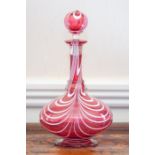 A Nailsea-type cranberry glass decanter and stopper,