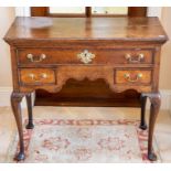 An 18th Century oak lowboy,