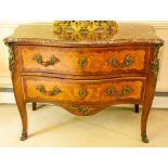 A French Louis XV style Kingwood marquetry and gilt metal mounted marble-topped bombe commode, circa