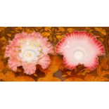 A pair of opalescent glass dishes, circa 1900, of frilled-edge form, the white glass fading to