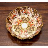 A Royal Crown Derby Imari lobed circular bowl, dated 1931 and decorated with pattern 2825, 16cm.