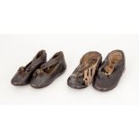 Two pairs of hard stuff leather baby shoes, the damaged pair have a wide strap (button missing and a