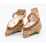 A pair of Chinese embroidered silk shoes, late Qing Dynasty, with wedge heel, worked with trailing
