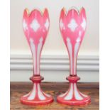 A pair of Bohemian ruby flashed and cased glass vases,