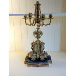 A French ormolu four-branch candelabra, late 19th Century, the architectural form base moulded