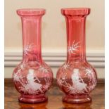 A pair of Mary Gregory type cranberry glass baluster vases, 28cm high