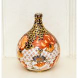 A Royal Crown Derby Imari miniature vase, circa 1885 and of onion form, decorated with pattern