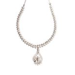 A diamond and 18ct white gold necklace comprising an open cluster pendant with a flower set with