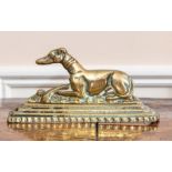 A cast brass figure of a greyhound, 20th Century, modelled recumbent.