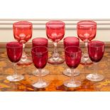 Nine various cranberry and ruby glass drinking glasses. (9)
