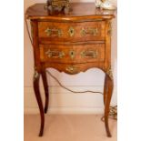 A reproduction French walnut cross-banded and gilt metal mounted bedside chest, the moulded