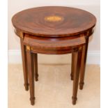 A reproduction nest of two mahogany oval occasional tables,