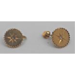 A pair of yellow metal and diamond set cufflinks, possibly high carat gold, the single stone