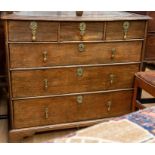 An 18th Century oak and cross banded chest of drawers, the moulded cross-banded top above three