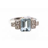 An aquamarine and diamond dress ring, the octagonal aquamarine weighing approx. 50ct, grain set