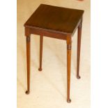 An Edwardian mahogany side table of square outline, 53cm high.