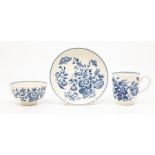A Worcester teabowl and saucer, circa 1770-90, printed in blue with the 'Three Flowers' pattern,