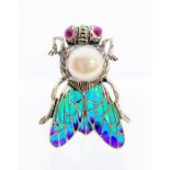 A plique a jour silver and enamel brooch in the form of a fly, with a cabochon ruby set eyes and