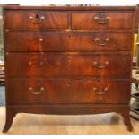 A George III mahogany cross banded and feather banded chest of drawers, the plain top cross and