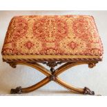 An early to mid Victorian mahogany X-frame salon stool, the seat upholstered in raspberry and