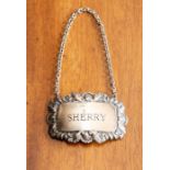 An Edwardian silver plated embossed label for 'Sherry'.