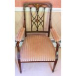 A pair of Edwardian inlaid mahogany open armchairs, having Gothic-influence openwork splats, the top