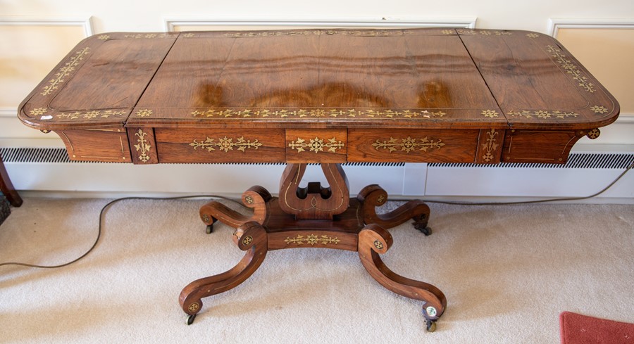 A Regency rosewood and brass inlaid sofa table,