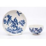 A Worcester teabowl and saucer, circa 1770-90, printed in blue with the 'Birds in Branches' pattern,