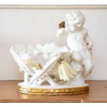 A Moore Brothers figural bowl modelled as a putto beside a lily flower, 14cm high.