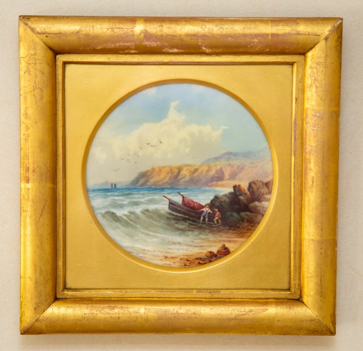 A pair of English porcelain plaques, circa 1900, of circular form, one painted with a coastal - Image 2 of 2