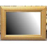 A good modern overmantel mirror, the bevelled rectangular plate within a ribbed gilt and 'verdigris'