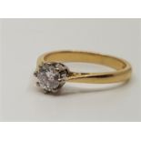 An 18ct. gold diamond solitaire ring, set round cut diamond (approx. weight 0.25 carats), assayed