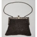 A Chinese export silver purse, the clasp repousse dragons, with twin section chain mail interior, (