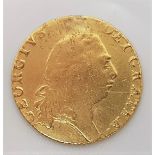 A 1794 George III gold guinea, fifth laureate head, R. 'Spade' shaped shield.