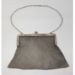 A silver mesh evening bag, by "S & LU", import assayed London 1920, width of clasp 15.6cm. (255.