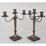 A pair white metal three branch candelabra, (white metal assessed as silver). lightly weighted
