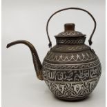 An Islamic Cairoware white metal inlaid copper kettle, with band of calligraphy to side, together