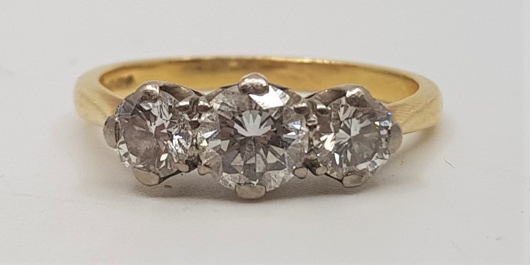 An 18ct. gold three stone diamond ring, set row of three graduated round brilliant cut diamonds (the - Image 3 of 3