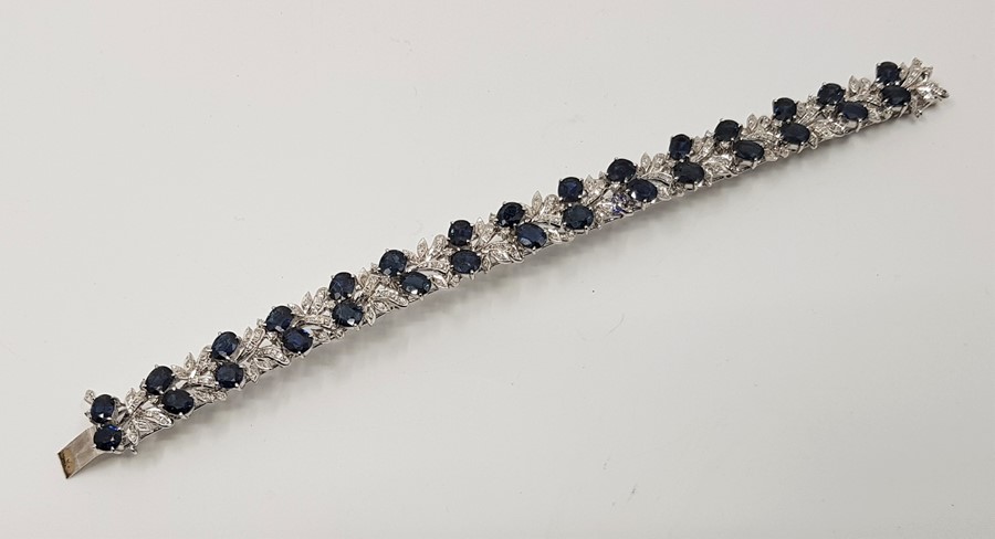 A blue sapphire and diamond fringe choker necklace, bracelet and drop earrings suite, mounted in - Image 3 of 7