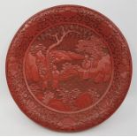 A Chinese cinnabar plate, diameter 15.8cm.