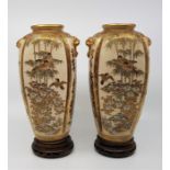 A pair of Japanese Meiji period Satsuma vases on stands. (2)