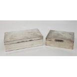 Two engine turned rectangular silver cigarette boxes, the smaller by Harman Brothers, assayed