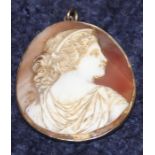 A 19th century cameo brooch, with carved shell profile bust viewed from behind, within white metal