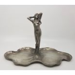 An Art Nouveau polished pewter figural centrepiece, cast as a maiden with flowing dress, the base